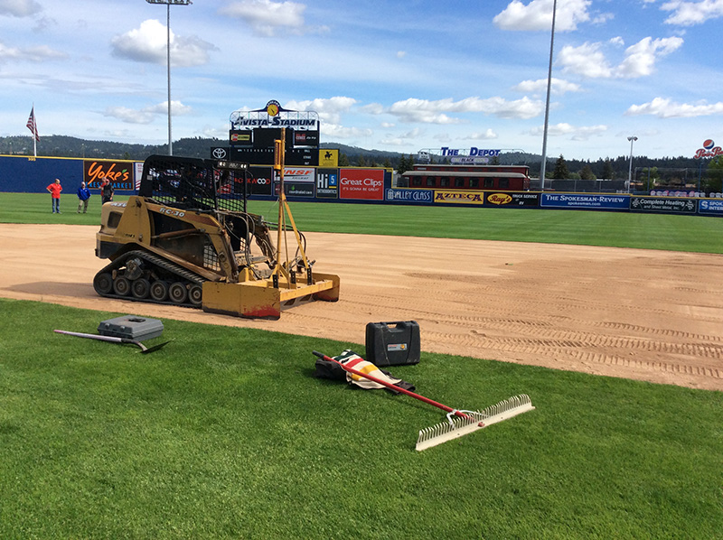 Laser grading Spokane Indians ball field